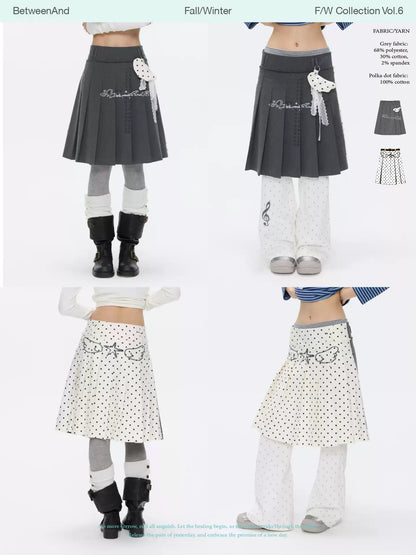 Grey and white reversible pleated skirt with polka-dot panels