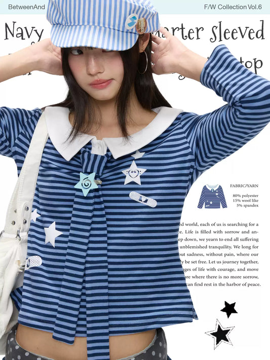 Navy star-pattern puff-sleeve top with peter pan collar