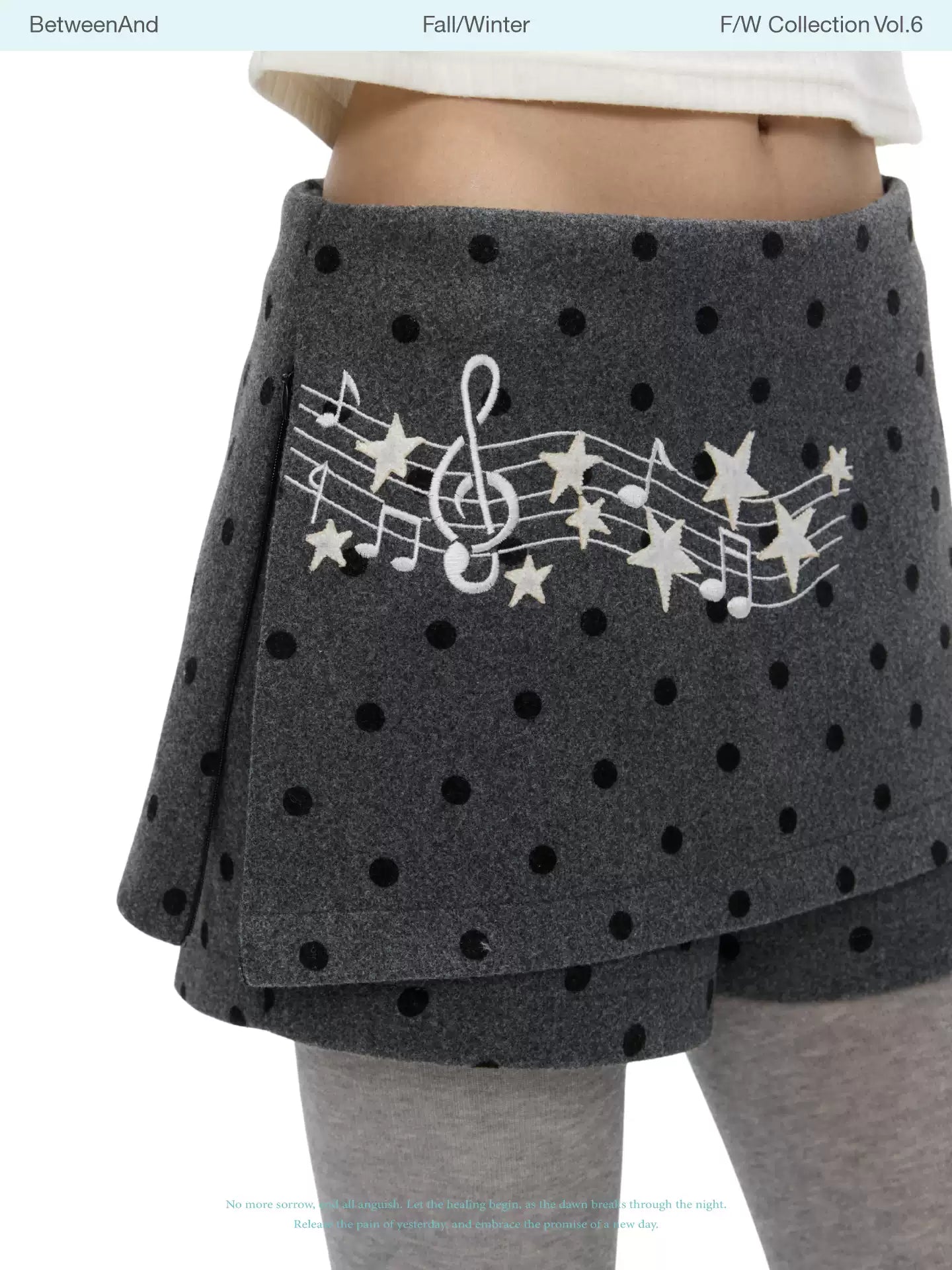 Grey wool skort with music-note polka-dot design